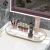Import High Quality Gold Bathroom Storage Rack Non-punching Tripod Wall Stainless Steel Shelves Cosmetic  Storage Rack from China
