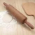 Import kitchen utensil baking tool silicone rolling pin with wood hand and Non-stick Surface from China