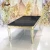 Import Stainless steel metal base black glass top gold dining table from China