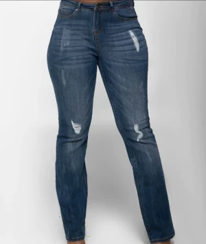 Women’s distressed bootcut denim jeans