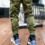Import 2021 New trendy muscle fitness mens clothing spring autumn sports casual cargo sweatpants reflective striped track pants from China