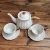 Import New Personalized antique white color embossed ceramic teapot sets tea cup and saucer coffee pot sets from China