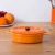 Import Porcelain baking pans orange color decorative ceramic bakeware with lid from China
