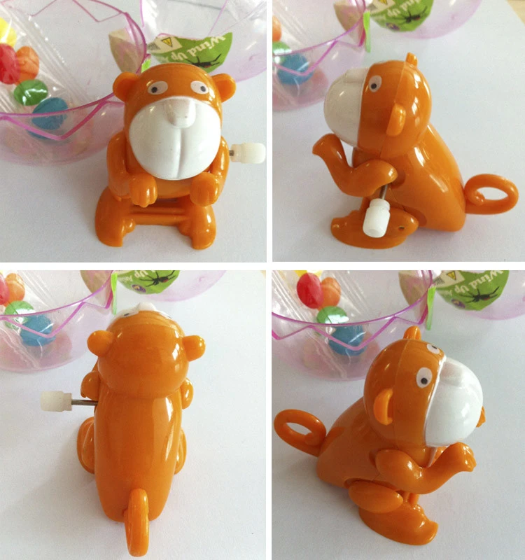 Wind up plastic monkey surprise egg toy candy with toys