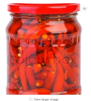 Pickled red chili in glass jar