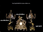 antique brass clock and tow candles