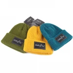 factory custom logo winter knitting hat,leather label fisherman beanie