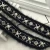 Import Hollow out Metal Eyelet Pearl Decoration Embroidery Woven Ribbon from China