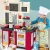 Import juguete de cocina girls pretend play kitchen toy electric cooking wares run water big kitchen set toys with music light from China