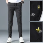 New spring and summer young mens fashion elastic pants loose breathable elastic fabric mens casual pants