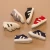 Import 2018 hot selling new soft canvas shoes solid color leisure baby shoes from China