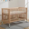 China Manufacturer Crib Baby Sleep Junior Bed Cot with Drawers Designs Portable
