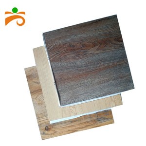 Durable antislip self-adhesive waterproof low price pvc flooring tiles designs
