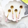 Good selling cute flower shape spoon ceramic handle golden Stainless Steel Tea Coffee Spoons set cutlery