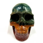 Wholesale natural hand carved crystal skull crystal art sculpture folk crafts colorful ocean jasper skull for decoration