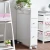 Import wholesale white wooden storage bathroom cabinet with basket drawer from China