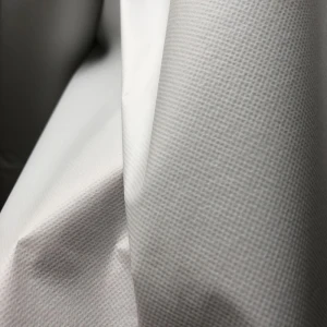 Breathable waterproof softshell nonwoven fabric laminated with white PE film