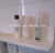 Import plastic self adhesive bathroom shelf rack plastic storage shelf from China