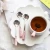 Import Good selling cute flower shape spoon ceramic handle golden Stainless Steel Tea Coffee Spoons set cutlery from China