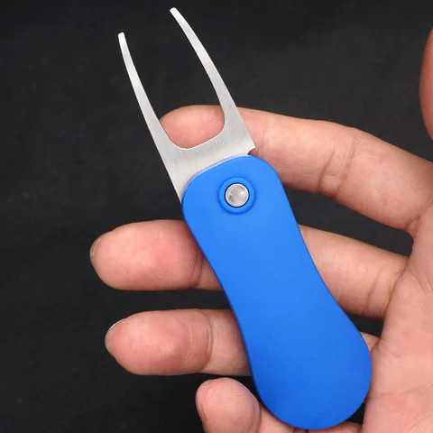 Lightweight portable pop-up button folding golf divot tool with custom detachable ball marker