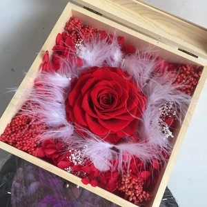 natural preserved rose flowers in wooden gift boxes with transparent cover as gift for valentine day