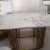 Import Oscar modern dining room furniture golden stainless steel with white marble top dining table set 6 chairs from China