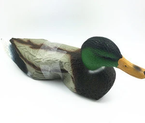 Plastic fake duck hunting decoy in garden