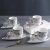 Import 90ML Ceramic Tea Cup With Irregular Saucer Coffee Cup With Saucer Espresso Cup from China