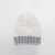 Import EE234 Winter Cable Knitted Beanie Caps with Decoration Label Slouch Thick Ski Hats Soft Fleece Lined Women Warm Knit Beanie Hat from China