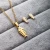 Import High Quality Fashion Gold Stainless Steel Fish Bone Wing Horse Flower Pendant Necklace Earrings Jewelry Set For Women from China
