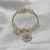 Import Hot selling fashion crystal bracelet small daisy cracked glass bead flower bracelet jewelry for women from China