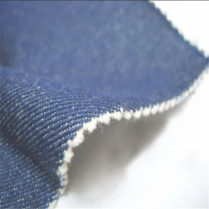 stocklot wholesale low price 9.5oz jean fabric roll 100% cotton indigo japan selvedge denim fabric