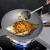 Import Top manufacturers non-stick cookware woks pan with titanium welding handle from China