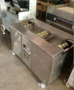 Ultrasonic anilox roller cleaner