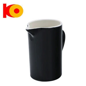 Black large ceramic milk jug and colorful glazed ceramic mini milk jug
