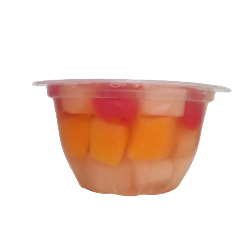 canned fruit in juice syrup fruit cocktail in plastic cup