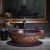 Import classical europe style round shaped solid surface matt black table wash basin from China