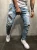 Import Wholesale bulk blue rip denim jeans pants with patch badge skinny mens jeans 2021 from China