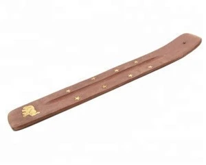 wooden incense stick holder.