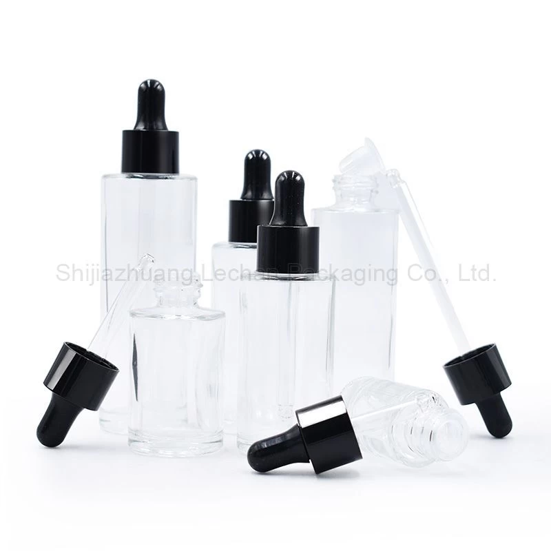 Buy Clear Glass Bottles With Dropper Cap Flat Shoulder Bottles from