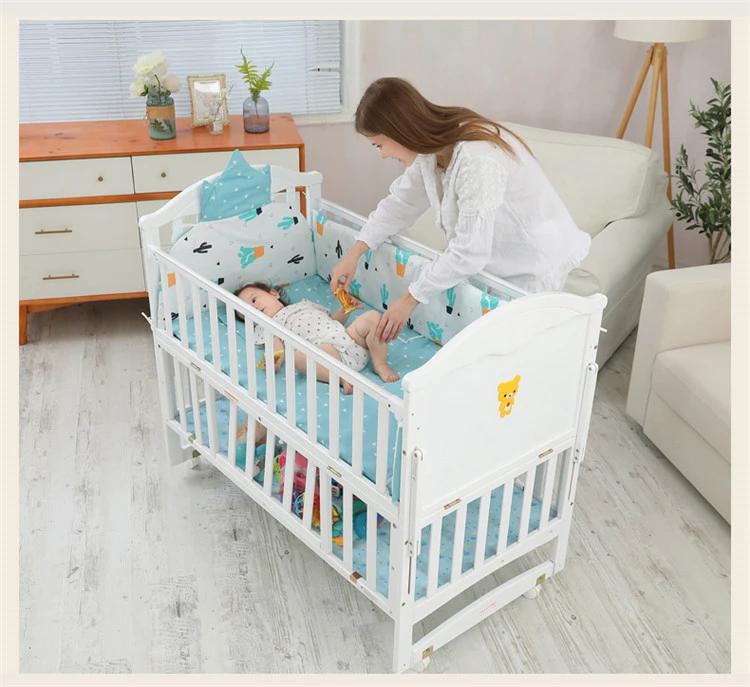 A cradle-type crib that can be spliced into a large bed  Removable solid wood crib  White new childrens bed