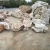 Import garden bacon red and white layer onyx landscaping boulder from China