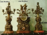 antique brass clock and candles