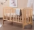 Import high quality wooden timber baby crib from China