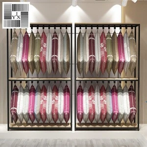 minimalistic display hook rack for items hanging independent assortment pillow display shelf