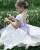 Import White Satin Baby Girl Dress With Long Train And Big Bow Flower Girl Dress from China