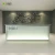 Import Aluminum frame glass panel standard size l shape counter hotel used standing white modern office reception desk from China