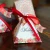 Import Delicate triangular flower ribbon wedding candy box favor box supplies from China