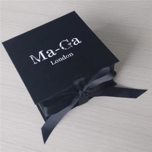 Black printed box with white printed logo with a black color ribbon matte lamination box, square shape box