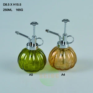 Colorful pumpkin shaped glass watering can pump